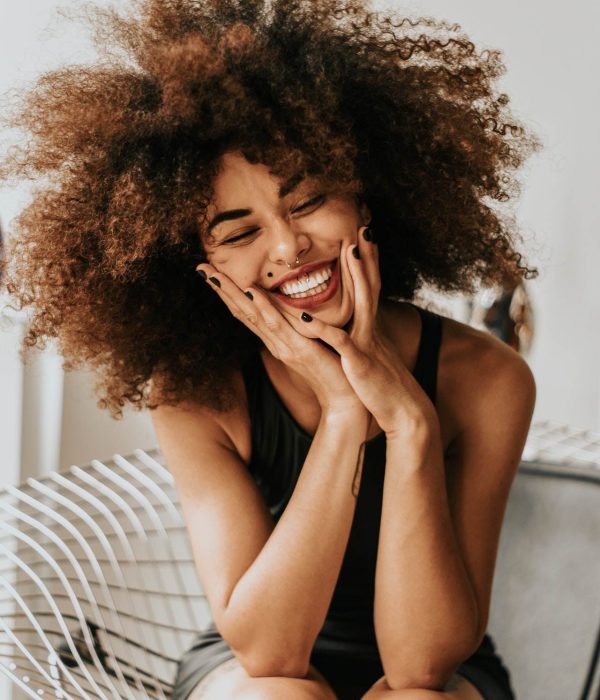 woman-sitting-and-smiling-1858175.jpg